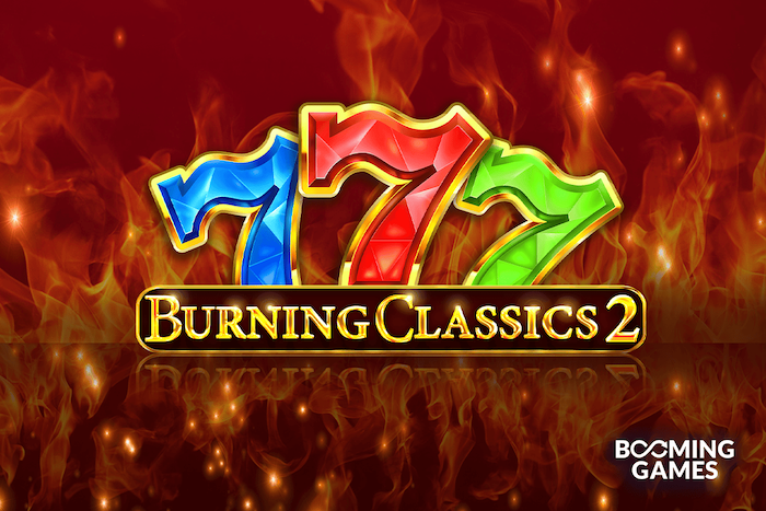 Burning Classics 2 slot game by Booming Games featuring colorful 777 symbols surrounded by flames on a red background.